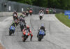 The start of MotoAmerica Superbike Race One at Road America in 2022 with Danilo Petrucci (9) and Jake Gagne (1) fighting for the lead into Turn Five. Photo by Brian J. Nelson.