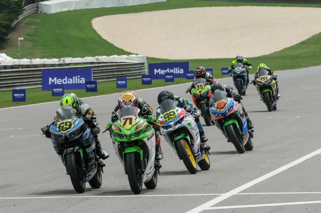 Levi Badie (71) won his first career MotoAmerica Junior Cup race with a .003 of a second victory over Hayden Bicknese (69) on Sunday. Photo by Brian J. Nelson, courtesy MotoAmerica.