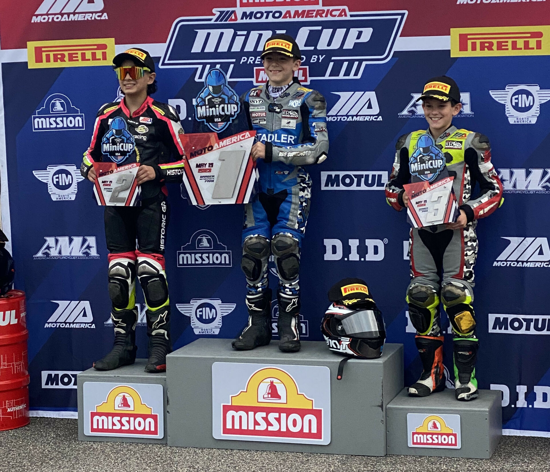 FIM Mini Cup 160 Ohvale Race Two winner Nathan Gouker (center), runner-up Mahdi Salem (left), and third-place finisher Reese Frankenfield (right) at Barber Motorsports Park. Photo by Paul Carruthers, courtesy MotoAmerica.