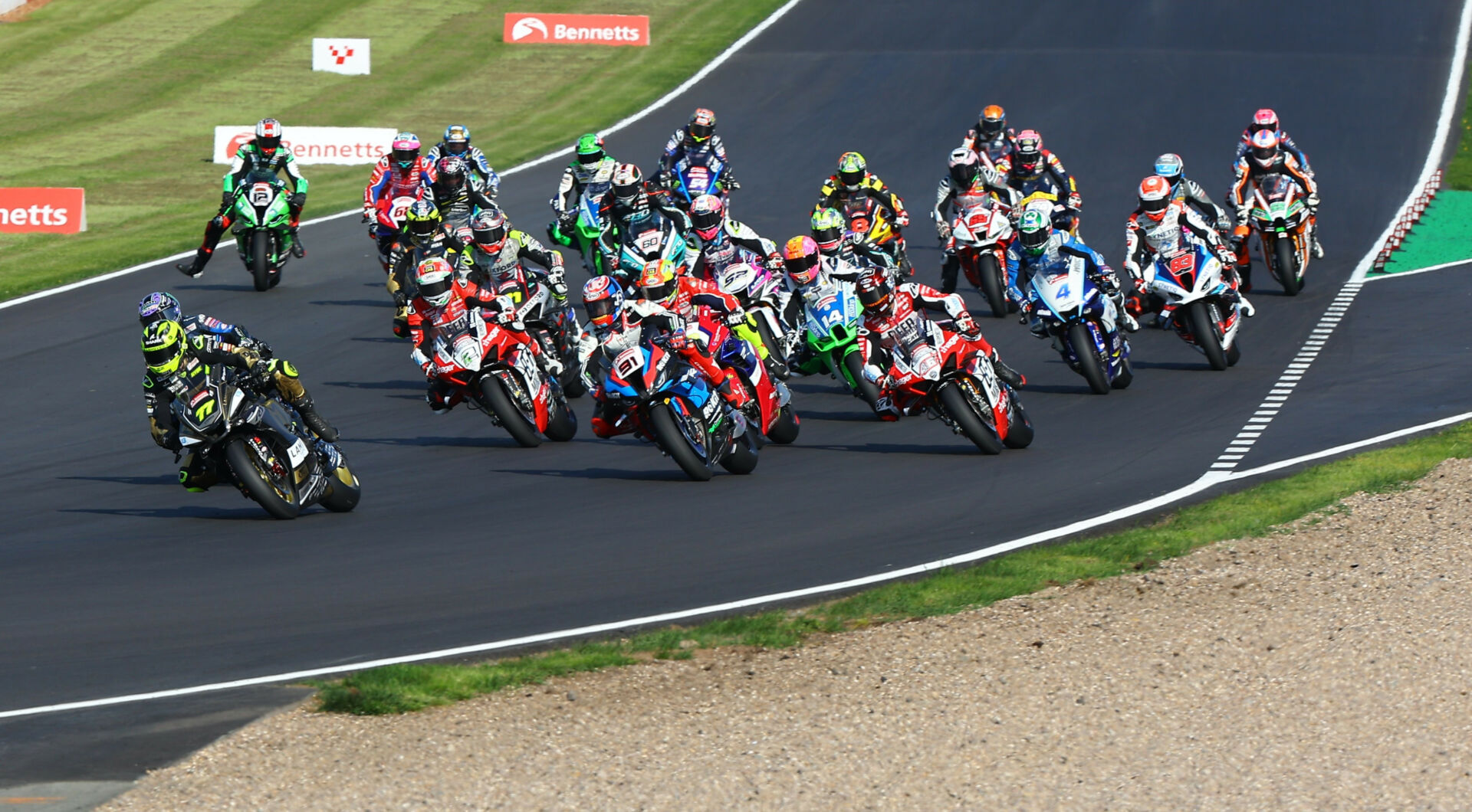 Kyle Ryde (77) leads the British Superbike field into Turn One at Donington Park. Photo courtesy MSVR.