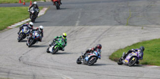 First lap Superbike action from Race Two Sunday at SMP with race winner Alex Dumas (23) leading over Sam Guerin (2), Jordan Szoke (101), Ben Young (1), Tomas Casas (18), Trevor Daley (9), and the rest. Photo by Rob O'Brien, courtesy CSBK.