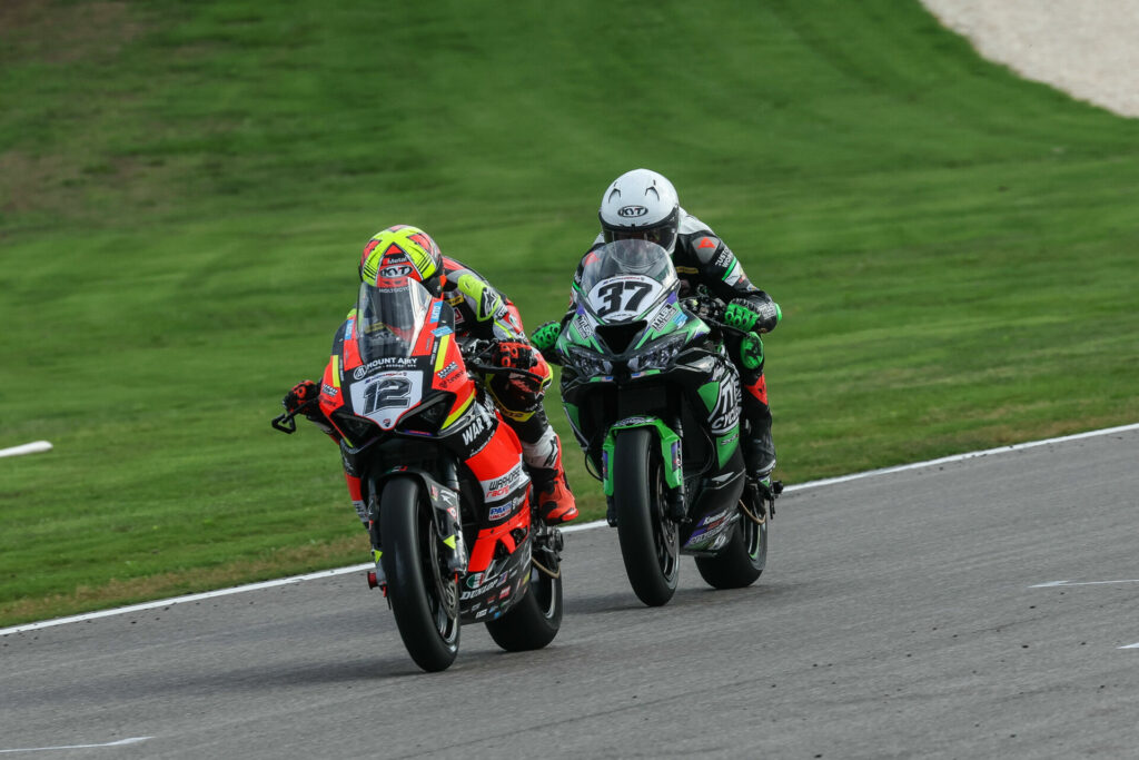 Xavi Fores (12) leads Stefano Mesa (37) during the "extended" MotoAmerica Supersport race at Barber. Photo by Brian J. Nelson, courtesy MotoAmerica.