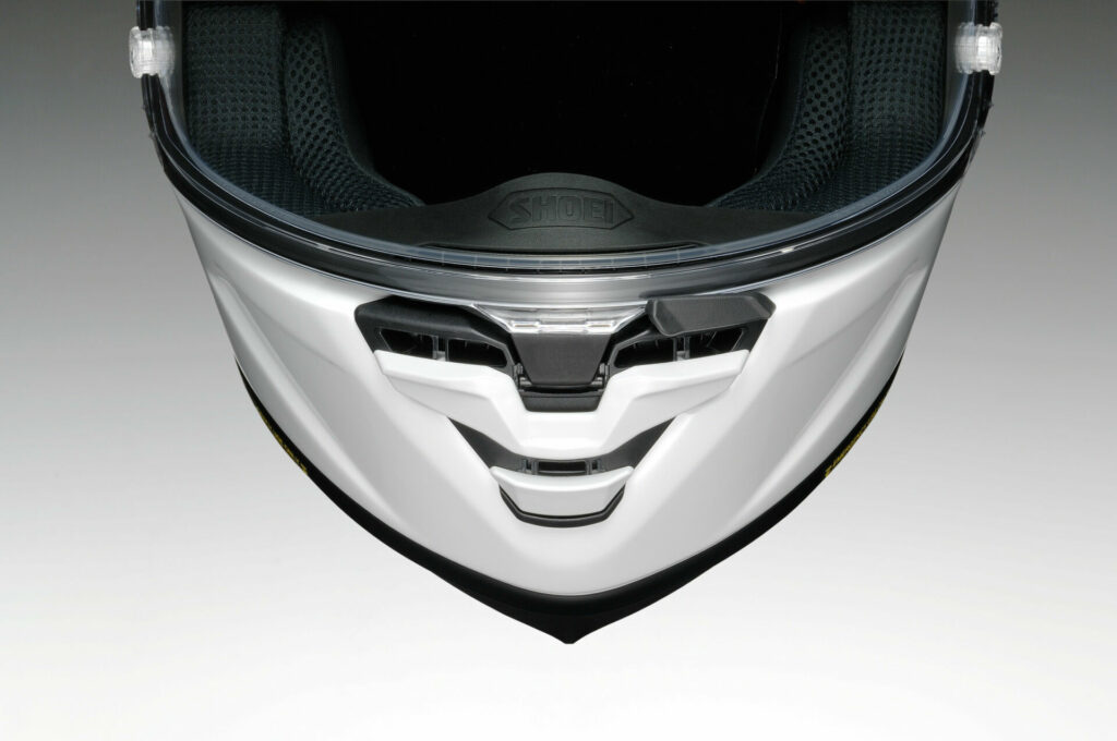 The centrally located face shield release mechanism on Shoei's new X-Fifteen helmet. Photo courtesy Shoei.