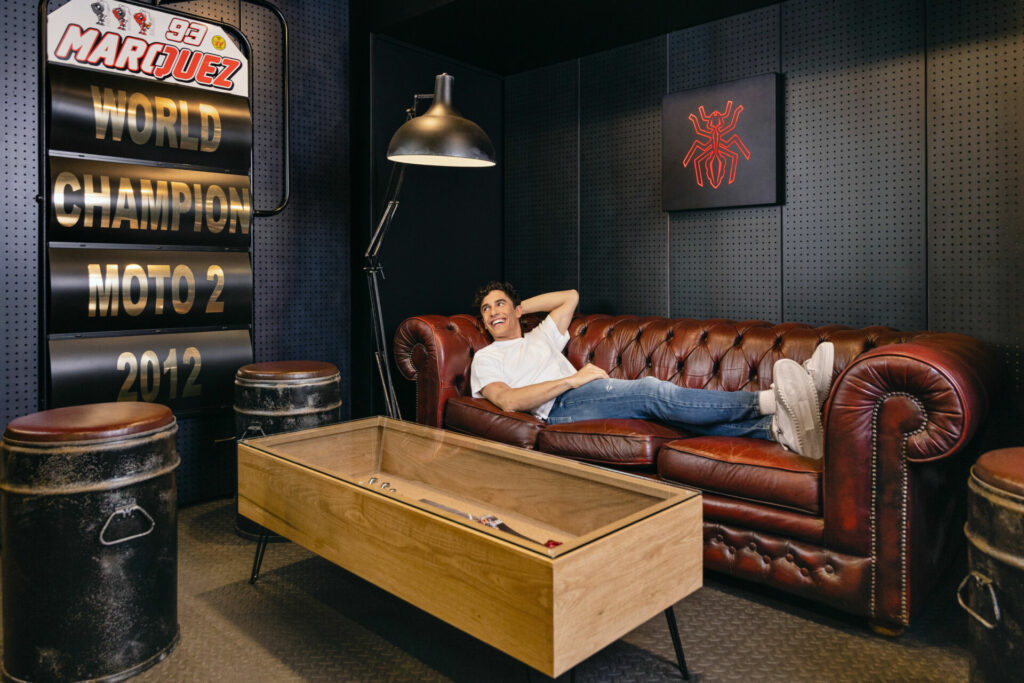 Marc Marquez relaxes on the couch in the living area of the special trailer. Photo by David Vilanova, courtesy Airbnb.