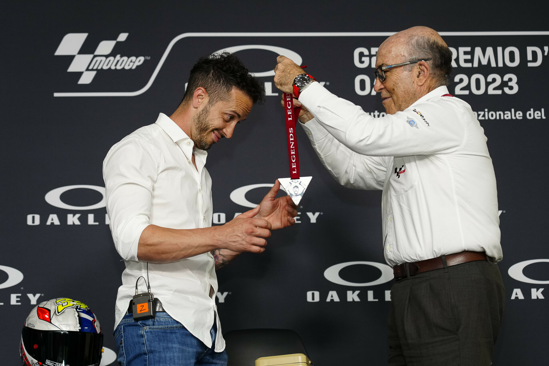 Dorna CEO Carmelo Ezpeleta (right) gives Andrea Dovizioso (left) his MotoGP Legend medal at Mugello. Photo courtesy Dorna.