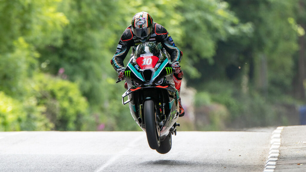 Peter Hickman (10) airborne on his way to victory Monday at the Isle of Man TT. Photo courtesy Isle of Man TT Press Office.