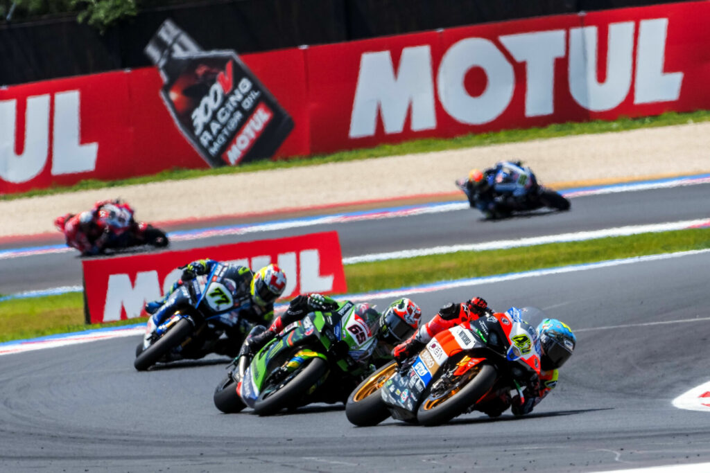 Axel Bassani (47) leads Jonathan Rea (65) and Dominique Aegerter (77) during Race One. Photo courtesy Dorna.