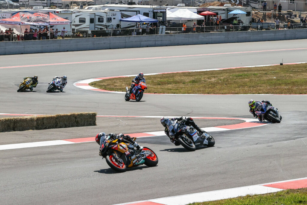 Mathew Scholtz (11) leading a group of riders early in Superbike Race Two. Photo by Brian J. Nelson, courtesy Westby Racing.