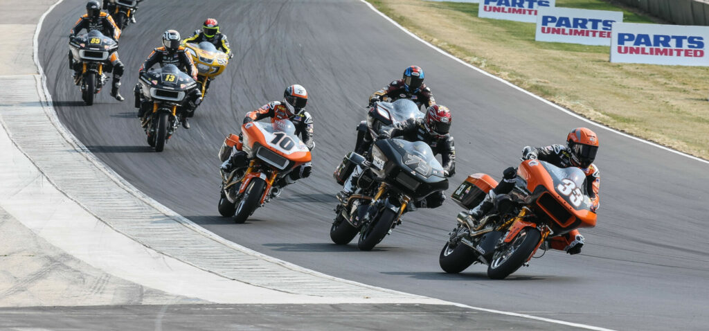 Kyle Wyman (33), Hayden Gillim (79), Travis Wyman (10), and the rest of the MotoAmerica King Of The Baggers field heads into Turn Five at Road America. Photo by Brian J. Nelson, courtesy Harley-Davidson.