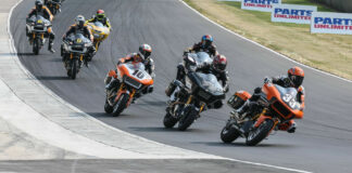 Kyle Wyman (33), Hayden Gillim (79), Travis Wyman (10), and the rest of the MotoAmerica King Of The Baggers field heads into Turn Five at Road America. Photo by Brian J. Nelson, courtesy Harley-Davidson.