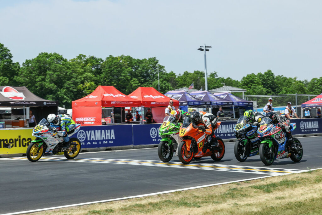 How close is close? Avery Dreher (99) looks over to witness the photo finish for second place in Saturday's Junior Cup race at Road America. Photo by Brian J. Nelson.