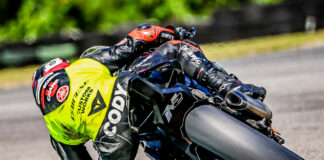 Cody Wyman tries to find the limits of the 3.4-hour-old Dunlop front tire by dragging his elbow for the photographer on the way to the win at CMP. Photo by Apex Pro Photographer, courtesy Army of Darkness.
