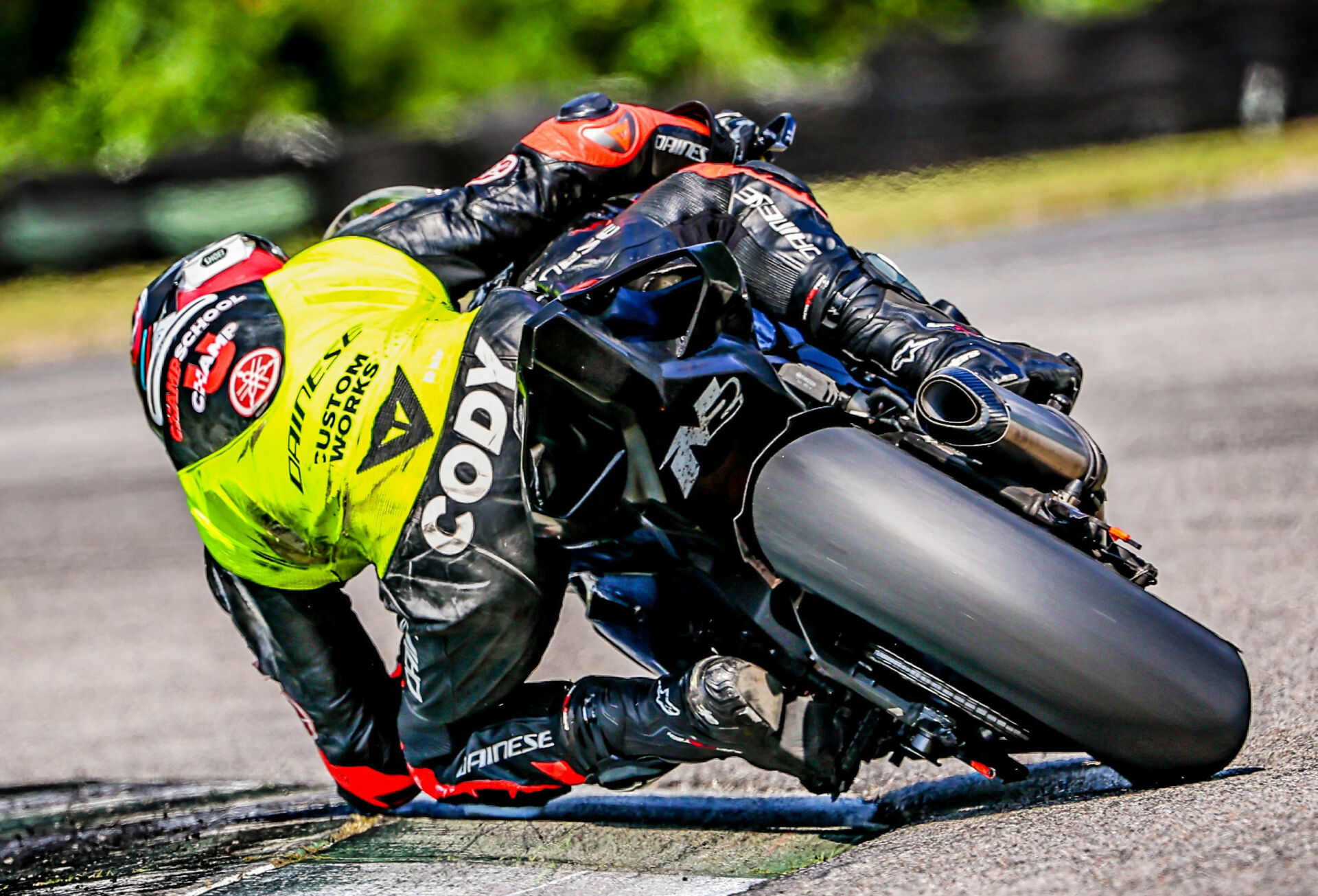 Cody Wyman tries to find the limits of the 3.4-hour-old Dunlop front tire by dragging his elbow for the photographer on the way to the win at CMP. Photo by Apex Pro Photographer, courtesy Army of Darkness.