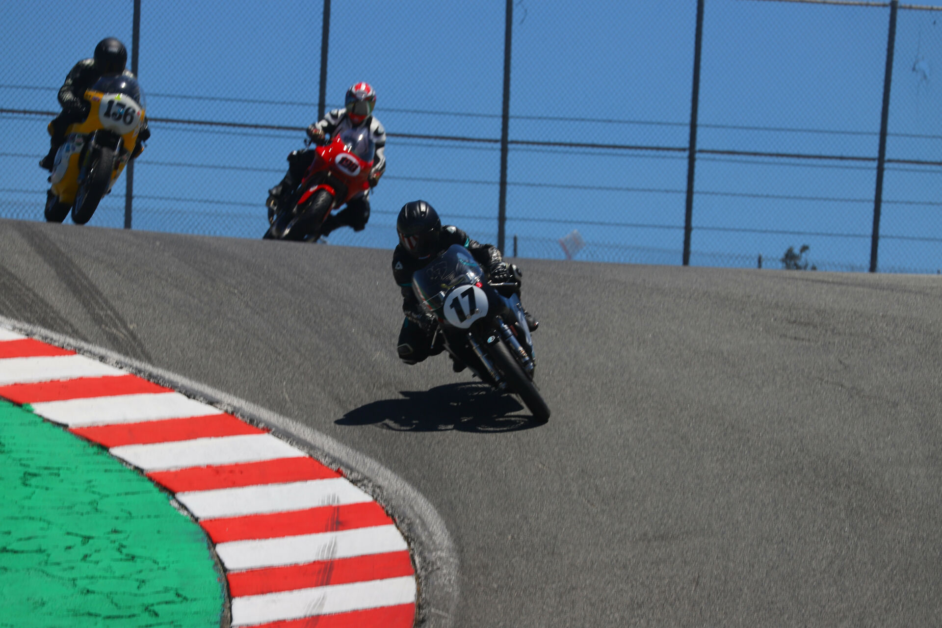 Kenny Cummings (17) leads some fellow AHRMA racers down the Corkscrew at Laguna Seca. Photo by etechphoto.com, courtesy AHRMA.