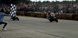 Bubba Shobert (67) takes the checkered flag ahead of Dale Quarterley (32) at the 1986 Loudon AMA Superbike race. Call them crude, but the hay bales were a significant step forward in rider safety at the time. Photo by Larry Lawrence.