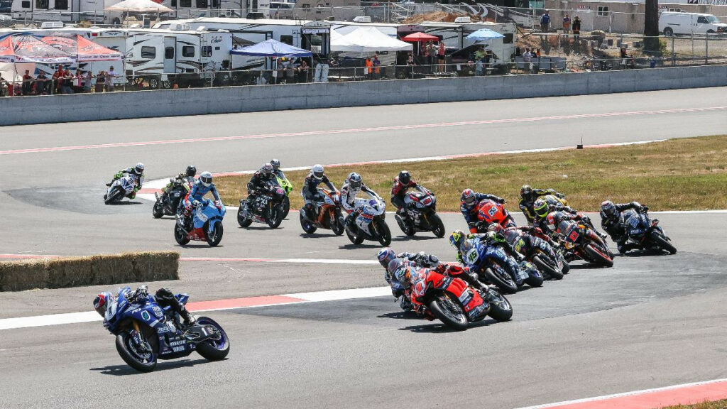 Jake Gagne (1) leads the field through the Turn One chicane at the start of Race Two at Ridge Motorsports Park. Photo by Brian J. Nelson.