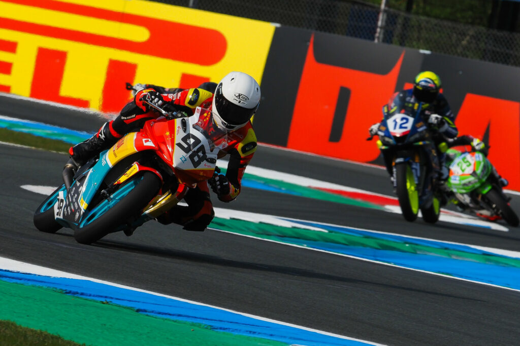 Chinese racer Zhou Shengjunjie (98) at speed on a Kove 321RR at Assen. Photo courtesy Dorna.