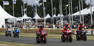 Lorenzo Savadori (32), Pol Espargaro (44), Michele Pirro (51), Kenny Lee Roberts (1), and Dakota Mamola (42) riding Alex Rins' LCR Honda on track at the Goodwood Festival of Speed. Photo courtesy Dorna.