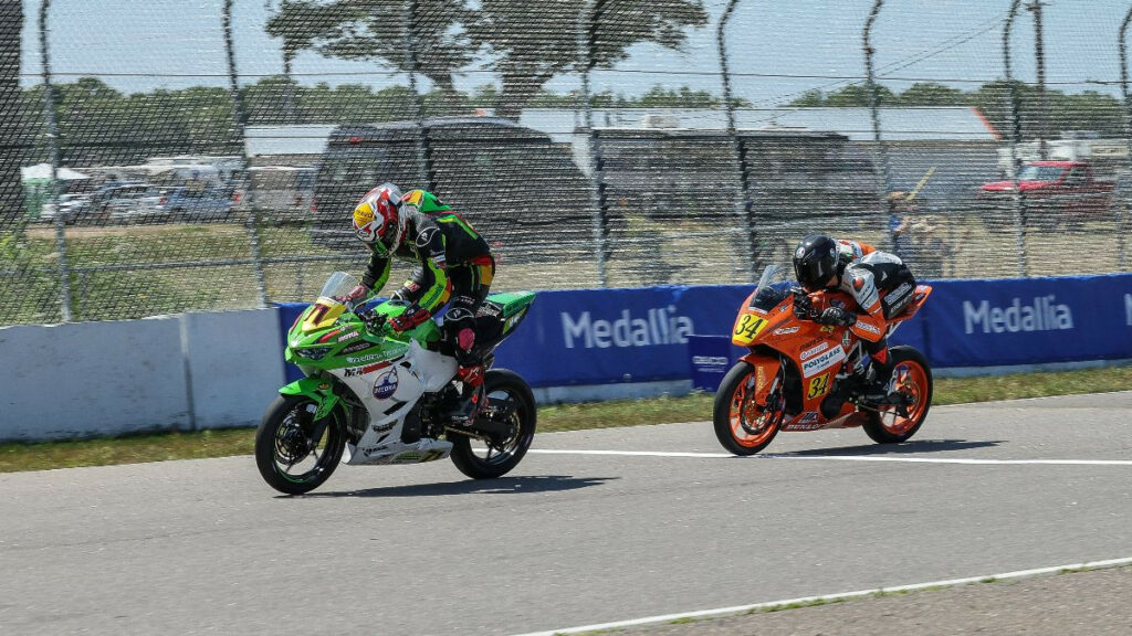 Levi Badie (71) celebrates his Junior Cup win over Rossi Moor (34) on Sunday at BIR. Photo by Brian J. Nelson, courtesy MotoAmerica.