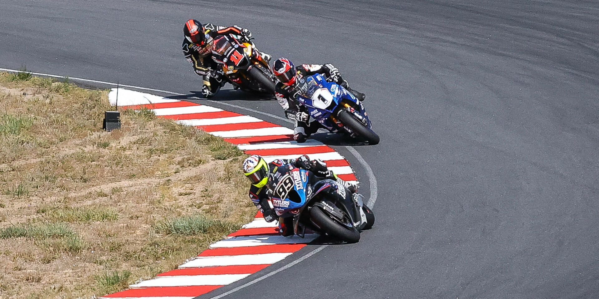 PJ Jacobsen (99) leads Jake Gagne (1) and Mathew Scholtz (11) in Superbike Race Two at Brainerd. Photo by Brian J. Nelson, courtesy Westby Racing.