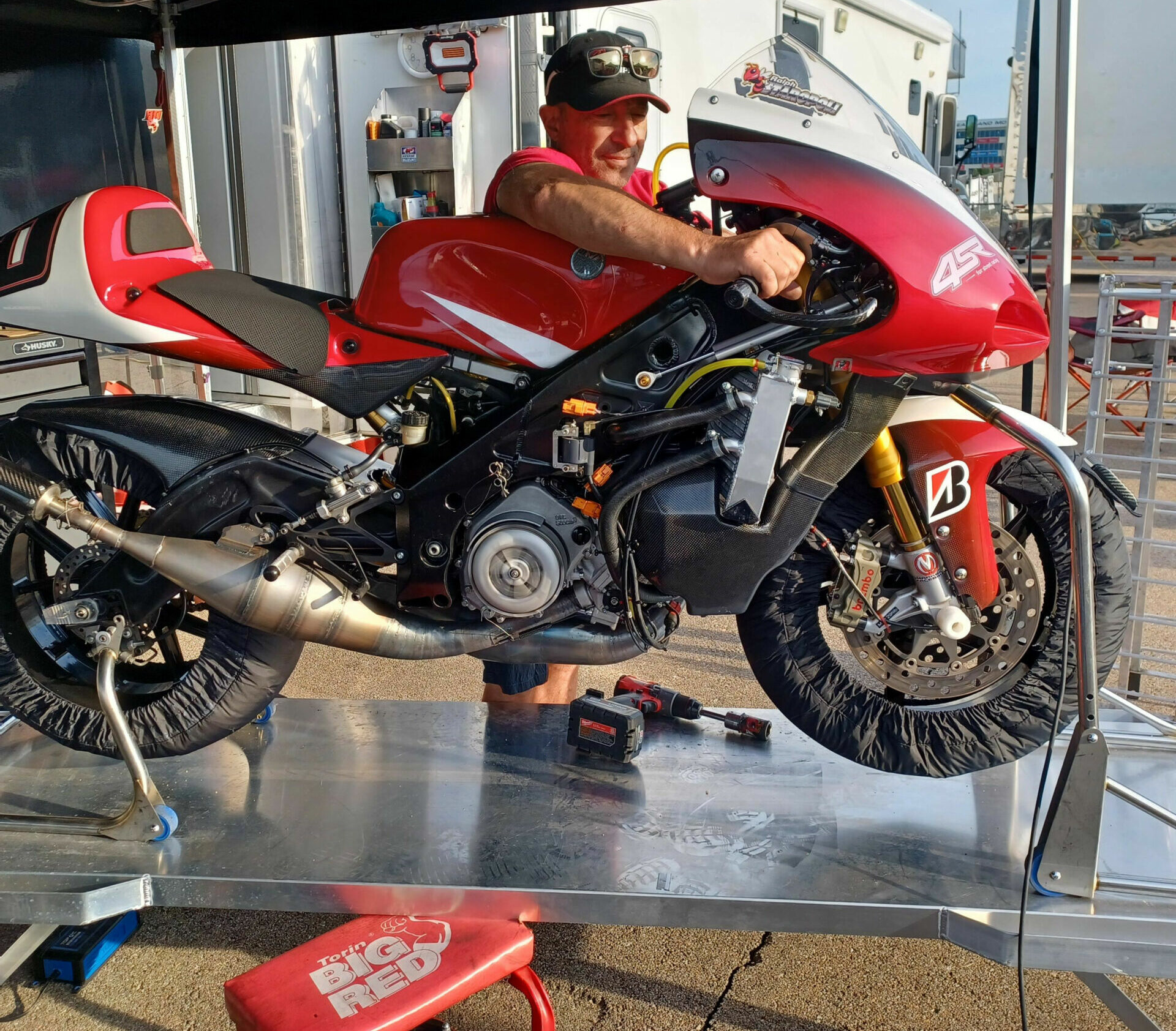 Ralph Staropoli warms up his trick Yamaha TZ250 at the 2023 Heartland Park AHRMA round. Not seen in this picture is his equally-kitted Honda RS250. “The Honda engine is stronger, the Yamaha handles better,” Staropoli says. “I can lap quicker on the Yamaha but love the head-shaking excitement of the Honda.” He builds and wins on them.