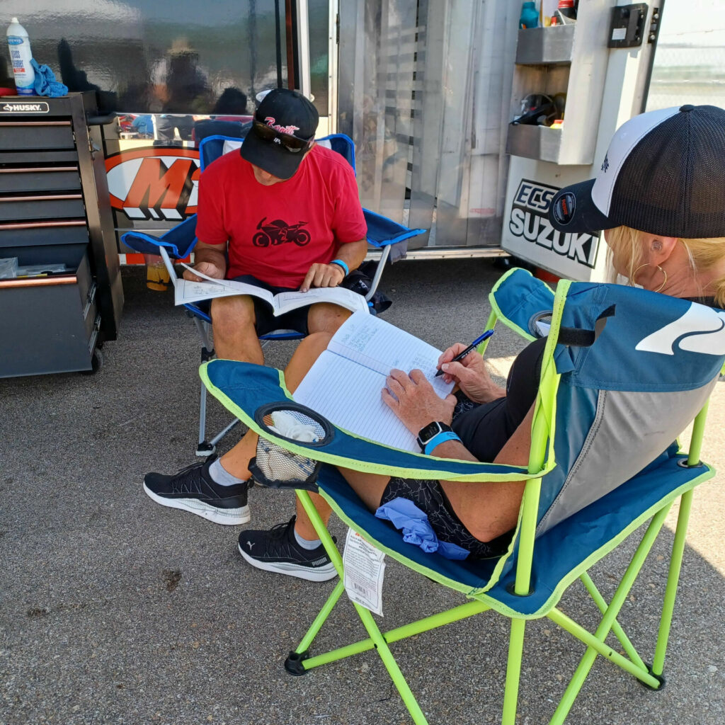 At the end of a winning two days at Heartland Park, rider and crew chief take a few minutes to list needed parts, check component hour logs, and get ready to be ready for the next round.