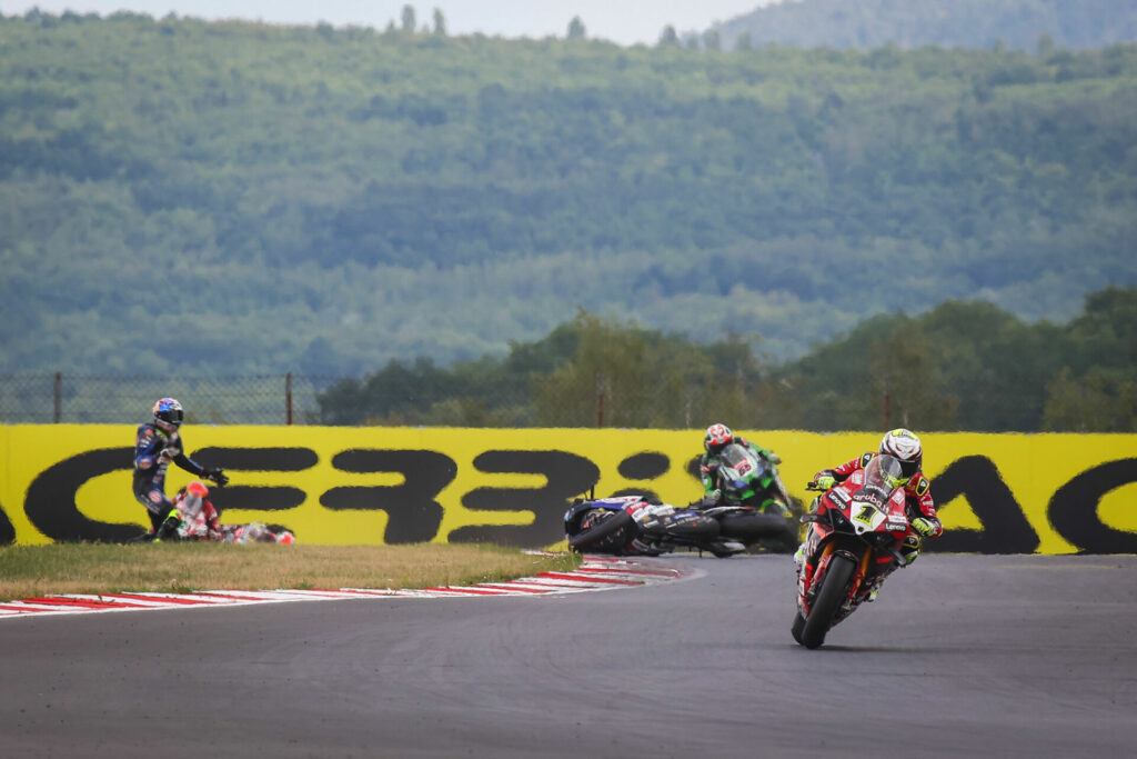 Toprak Razgatlioglu (standing to the left) crashed out of Race Two. Photo courtesy Dorna.