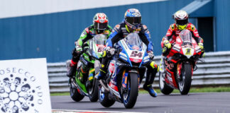 Toprak Razgatlioglu (54), Jonathan Rea (65), and Alvaro Bautista (1) race for position in England. Photo courtesy Dorna.