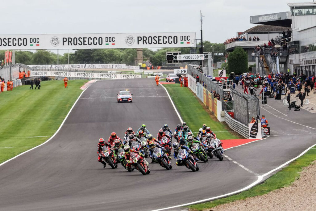 Alvaro Bautista (1) leads the field into the first corner at Donington Park. Photo courtesy Dorna.