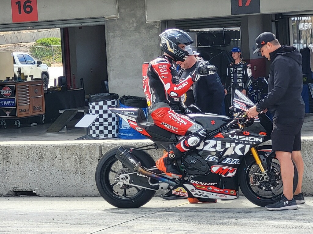 Brandon Paasch on his new Vision Wheel M4 ECSTAR Suzuki GSX-R1000R Superbike on pit lane at Laguna Seca with Team Manager Chris Ulrich. Photo courtesy Team Hammer.