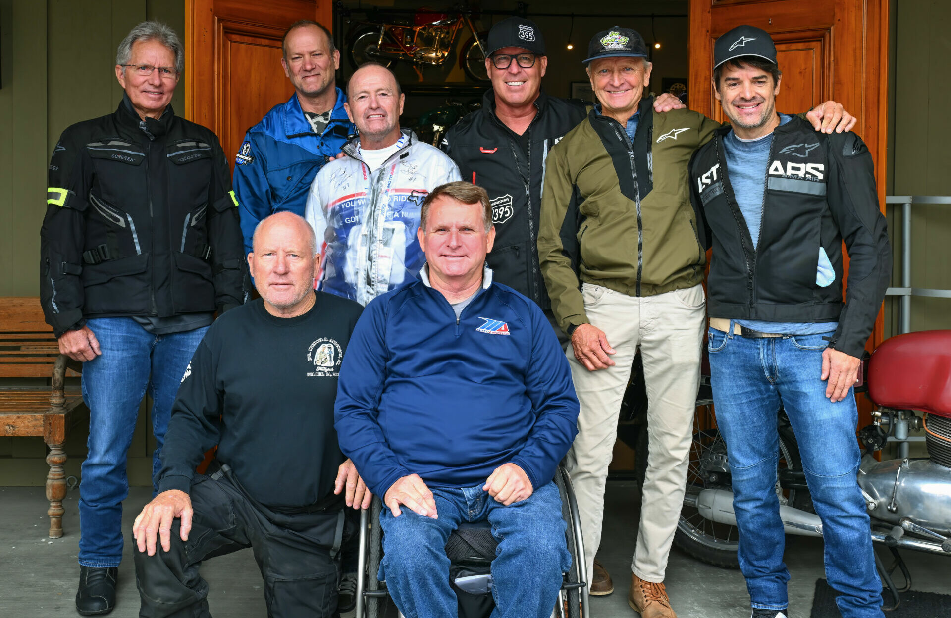 Wayne Rainey (center) is surrounded by legends. (From left) Eddie Lawson, King Kenny Roberts, Doug Chandler, Bubba Shobert, Rick Johnson, Kevin Schwantz, and Carlos Checa. Photo by Jeff Bushnell Photography.