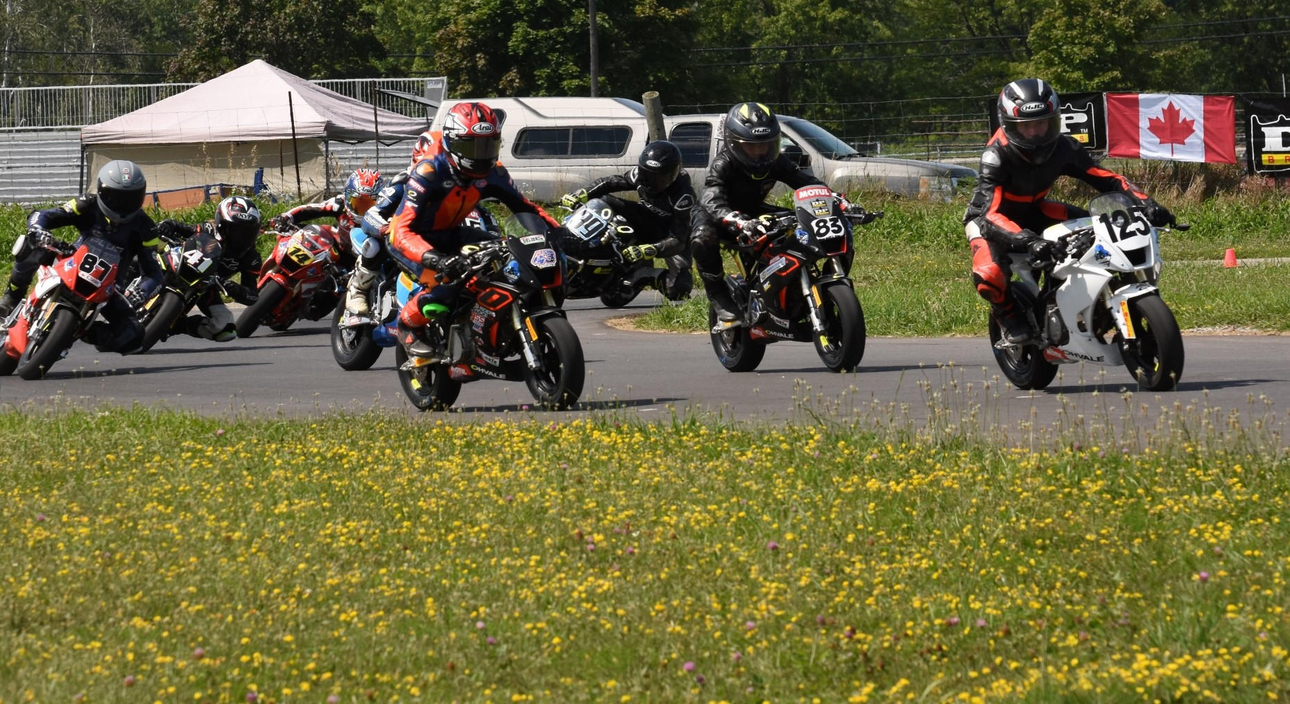 Inaugural FIM MiniGP Canada Series champion Michael Galvis (83) trails rivals Treston Morrison (125) and Ben Hardwick (43) ahead of the rest of the field early in race one at Lombardy on Sunday. Photo Jeremy Fleming, courtesy FIM MiniGP Canada.