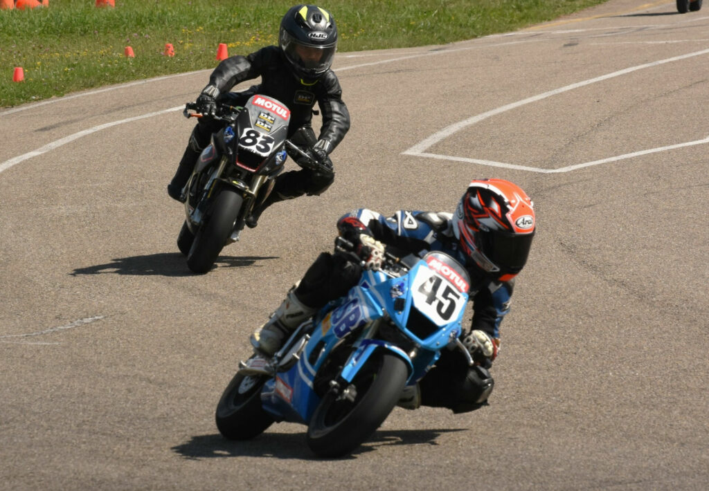 Ashton Parker (45) leading Michael Galvis (83) on track. Photo by Colin Fraser.