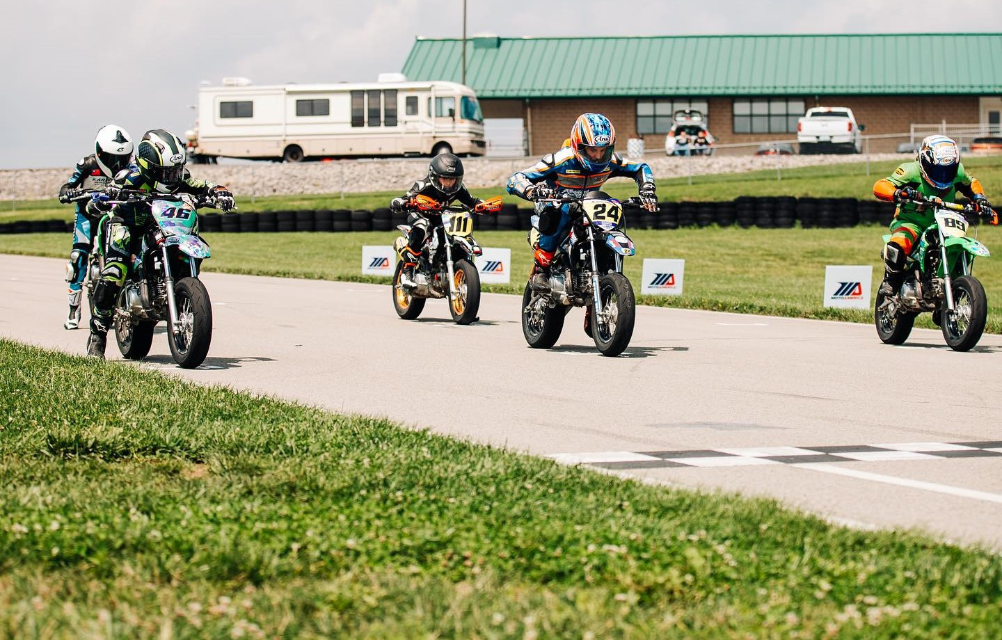 Jacob Davis (46), Blake Sorrentino (111), Cole Varnes (24), and Joel Laub (89) prepare to start a Stock 110 race at Pittsburgh International Race Complex's kart track. Photo courtesy MotoAmerica.