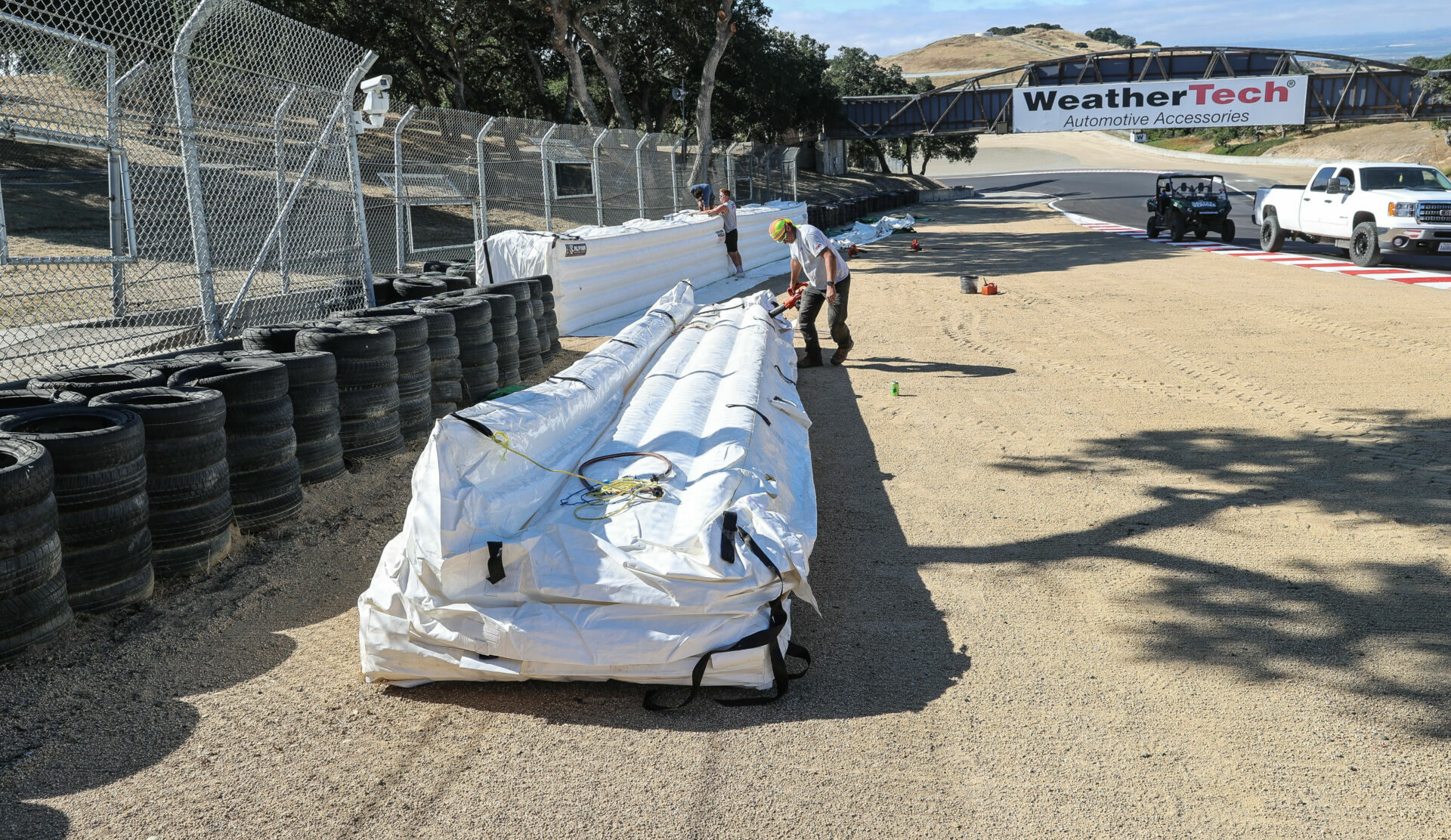 Inflatable sections of Alpina safety barriers being put into place ahead of the MotoAmerica races at WeatherTech Raceway Laguna Seca. Photo by Brian J. Nelson.