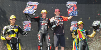 Tyler Scott (second from left) stands atop the podium with mechanic Dustin Cyr (second from right) after winning Supersport Race Two over runner-up Xavi Fores (far left) and third-place finisher Stefano Mesa (far right). Photo by Brian J. Nelson, courtesy Suzuki Motor USA, LLC.