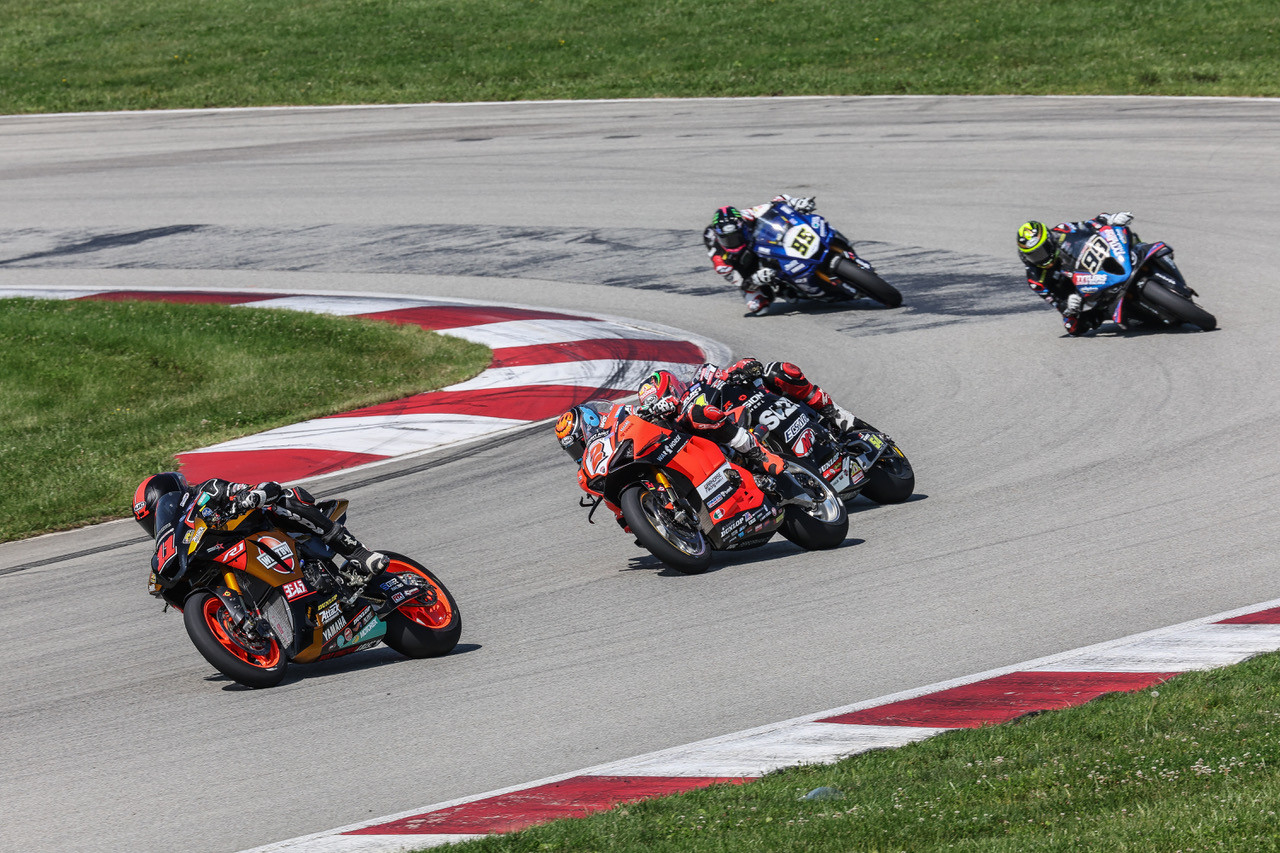 Mathew Scholtz (11) leads Josh Herrin (2), Richie Escalante (54), PJ Jacobsen (99), and JD Beach (95) at PittRace. Photo by Brian J. Nelson, courtesy Westby Racing.