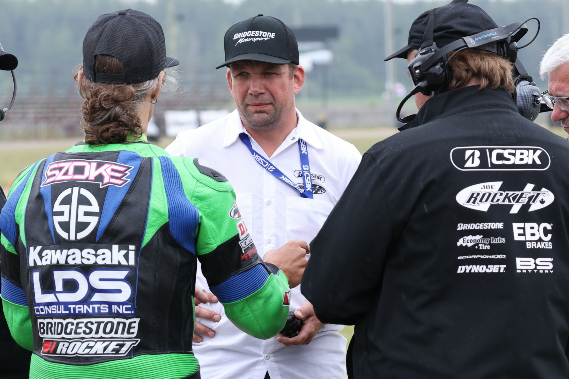 Ross Millson (center) speaking with 14-time CSBK Champion Jordan Szoke (left) and CSBK Tech official Fred Benjamin (right) at Grand Bend Motorplex. Photo by Rob O'Brien, courtesy CSBK.