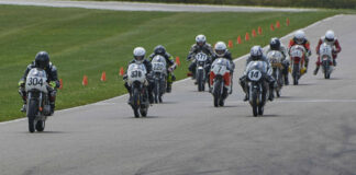 The start of an AHRMA race at Gingerman Raceway with Kevin Dinsmoor (304) leading the combined, three-class field including Andy Findling (338), Tim Terrell (220), Dave Roper (7), Alex McLean (14), Robert Himmelmann (777), Stuart Sanders (215), Craigi Hirko (641), and David Rhodes (97) into Turn One. Photo by Bill Griffin, courtesy AHRMA.