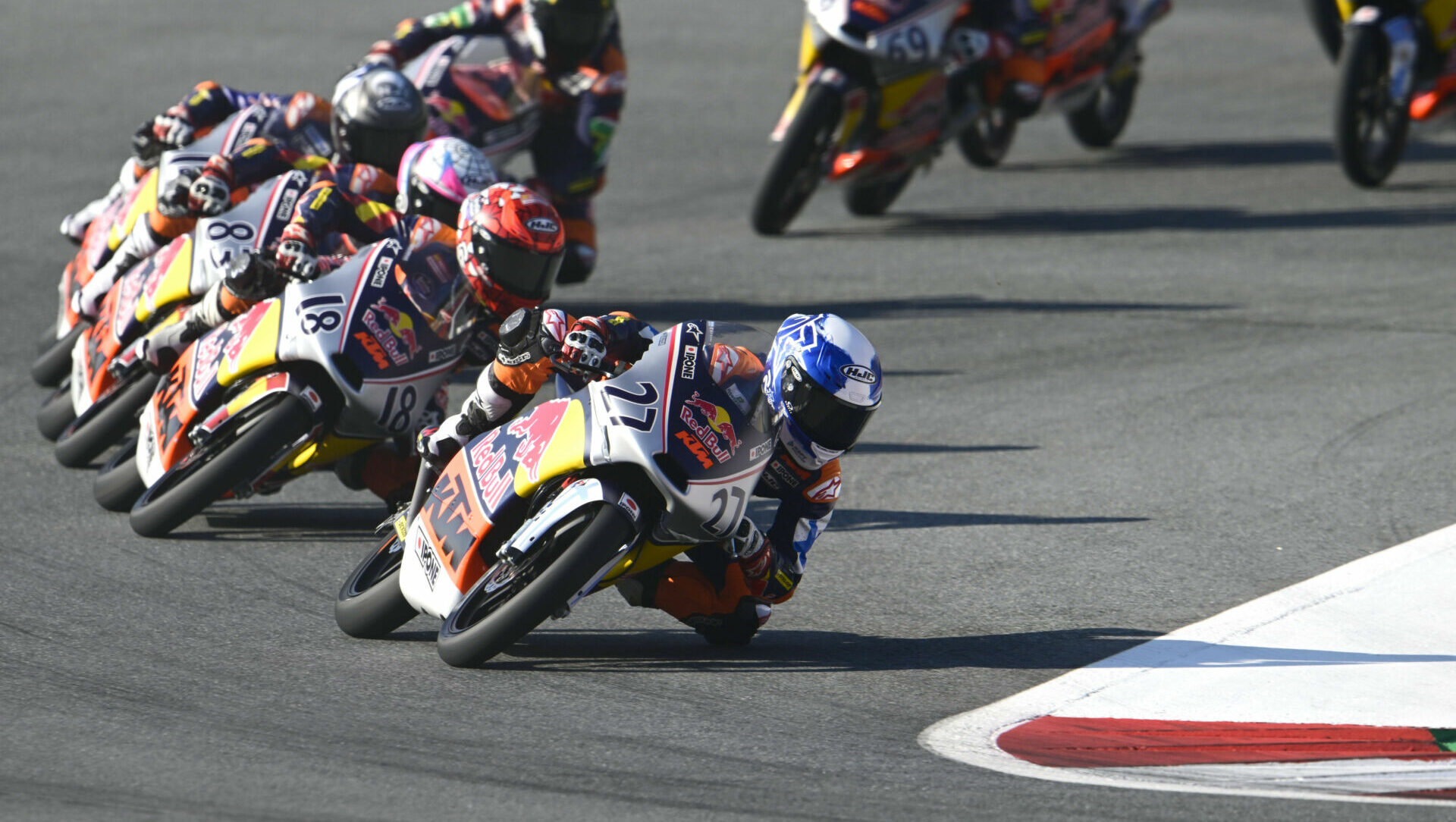 Rico Salmela (27) leads Angel Piqueras (18) and the rest of the field during Red Bull MotoGP Rookies Cup Race Two in Austria. Photo courtesy Red Bull.
