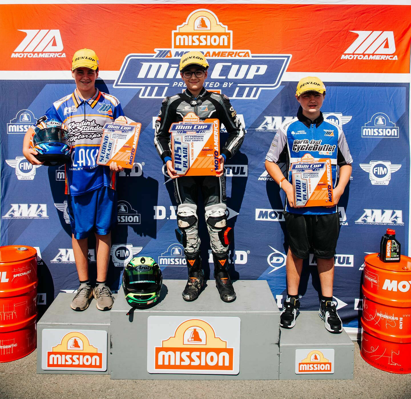 Stock 125 race winner Nathan Bettencourt (center), runner-up Cole Varnes (left), and third-place Colin Sweeley (right). Photo courtesy MotoAmerica.