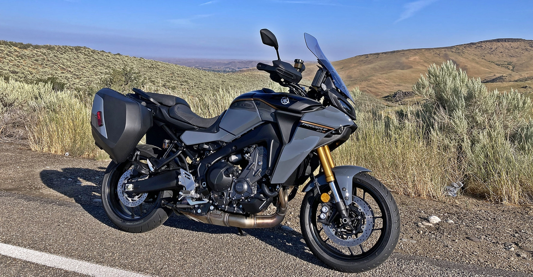 Yamaha's 2024 Tracer 9 GT+, resting on an Idaho back road, is loaded with technology that helps the machine do what it does best - eat miles on the open road and perform in the twisties. Photo by Michael Gougis.