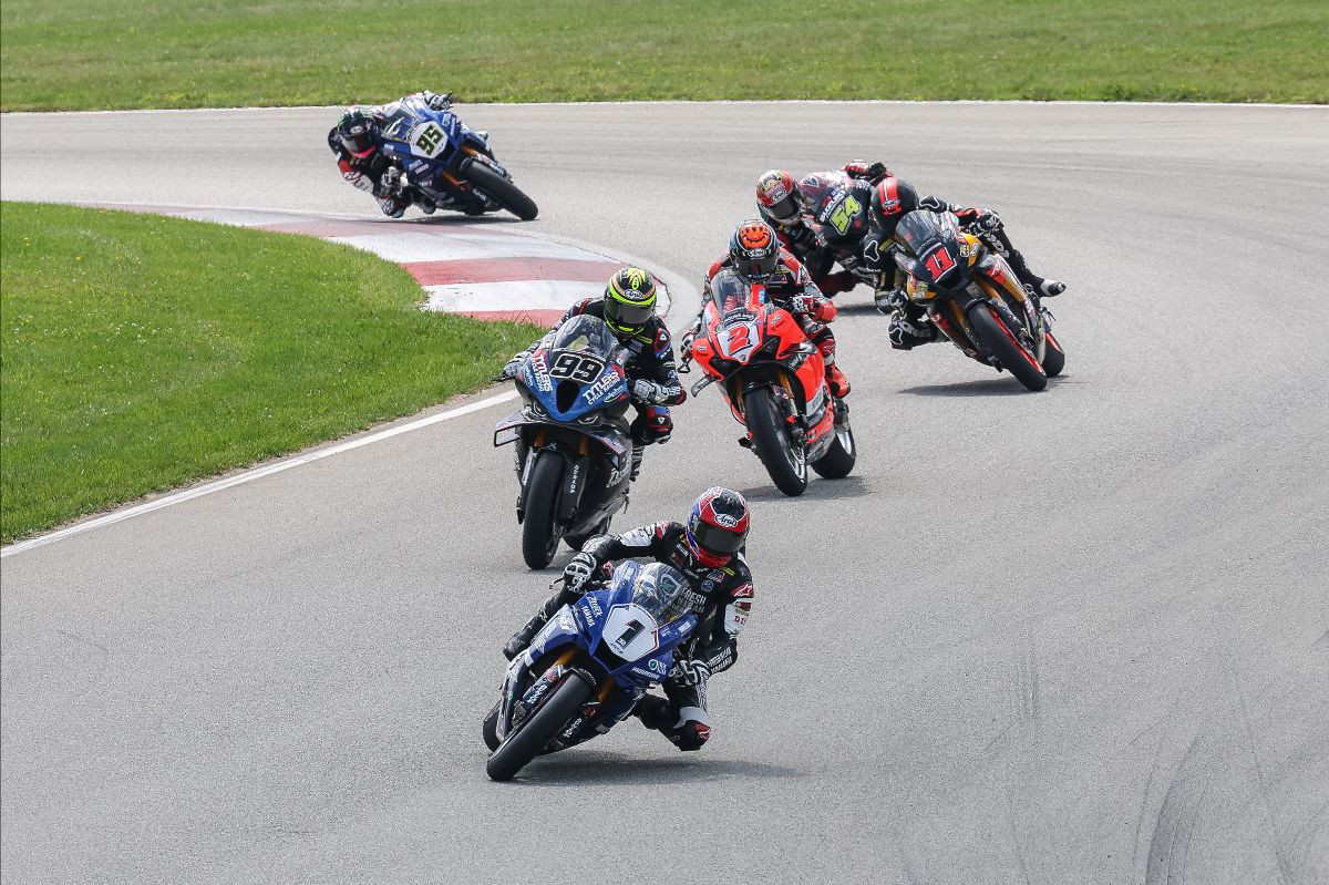 Jake Gagne (1) leads the second of three MotoAmerica Medallia Superbike races over PJ Jacobsen (99), Josh Herrin (2), Mathew Scholtz (11), Richie Escalante (54) and JD Beach (95). Photo by Brian J. Nelson, courtesy MotoAmerica.