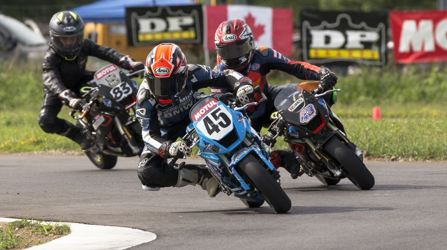 Ashton Parker (45) leading an FIM MiniGP Canada race in Ontario. Photo by Colin Fraser.