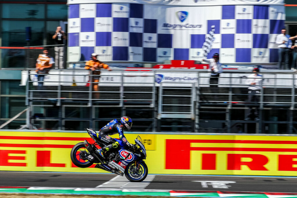 Toprak Razgatlioglu (54) celebrated his Race One victory with a stoppie across the finish line. Photo courtesy Dorna.