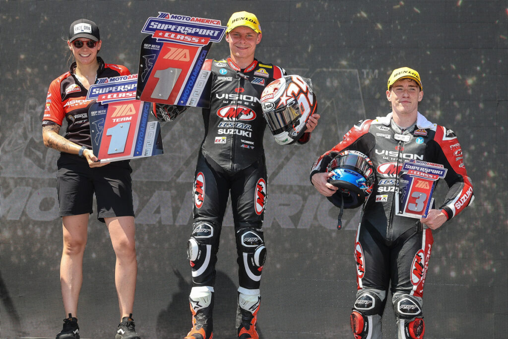 Supersport Electronics Engineer Chloé Lerin (left) with Tyler Scott (center) and Torin Collins (right) on the podium at Circuit of The Americas (COTA). Photo by Brian J. Nelson, courtesy Suzuki Motor USA, LLC.