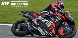 The Aprilia's fairing shape is designed to create a venturi effect to suck the bike toward the ground when it is at full lean. This means using a lower that is shaped like a cross-section of an airfoil, with the rear tapering back toward the center of the motorcycle and a “tunnel” that exhausts air from underneath the leading edge of the fairing lower. In this photo from the season-opening Grand Prix in Portugal, note how the section of the fairing just ahead of Aleix Espargaro's foot is shaped. That section is closer to the centerline of the bike. The fairing above and below it bulges outward. When the bike is on its side, that “tunnel” section creates a hollow that accelerates the flow of air along the fairing forward of it. That generates downforce. Note also the “spats” on the front wheel and swingarm, which manage airflow and help create downforce. Photo by Michael Gougis.