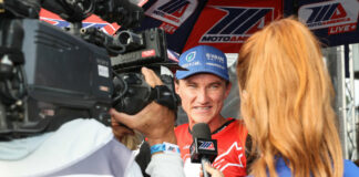 Jake Gagne being interviewed in 2022 by Hannah Lopa, part of MotoAmerica's in-house TV production team. Photo by Brian J. Nelson.