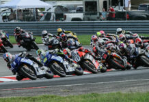 Jake Gagne (1) leads Cameron Petersen (45), Danilo Petrucci (9), Mathew Scholtz (11), PJ Jacobsen (66), and the rest of the field at the start of a MotoAmerica Superbike race in 2022 at NJMP. Photo by Brian J. Nelson.