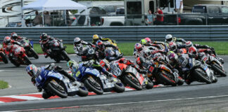 Jake Gagne (1) leads Cameron Petersen (45), Danilo Petrucci (9), Mathew Scholtz (11), PJ Jacobsen (66), and the rest of the field at the start of a MotoAmerica Superbike race in 2022 at NJMP. Photo by Brian J. Nelson.